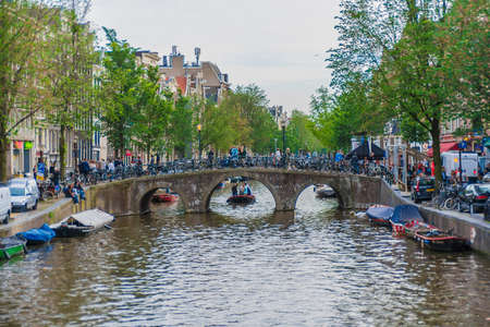 AMSTERDAM, NETHERLANDS â JUNE 14, 2013: One of the many bridges across Amsterdam canals.のeditorial素材