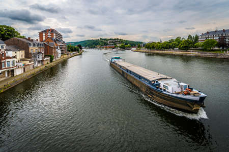 River Meuse as it passes through the city of Namur in the Wallonia Region, southern Belgiumのeditorial素材