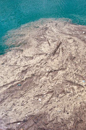 Trash floating onn contaminated watersの写真素材