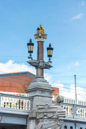The Blauwbrug (Blue Bridge) connects the Rembrandtplein area with the Waterlooplein area in Amsterdam, Netherlands.の写真素材