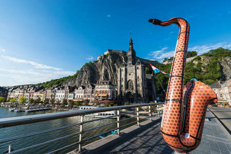DINANT, BELGIUM â JUNE 15, 2014: The bridge crosses the river Meuse passing through the town of Dinant, located in the Walloon region of southern Belgium.のeditorial素材