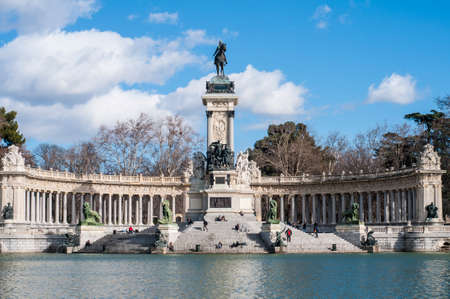 MADRID, ES â JANUARY 24, 2013: People walking near Monument to King Alfonso XII (Monumento a Alfonso XII), situated on the east edge of the artificial lake near the center of the Buen Retiro Park.のeditorial素材