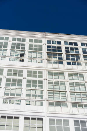 Traditional white wooden glazed windows in A Coruna, Galicia, Spain.