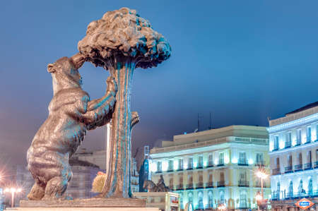 Statue of the Bear and the Strawberry Tree (Oso y el Madrono), sculpture which represents the heraldic arms of the city, installed on Puerta del Sol Square in Madrid, Spain.のeditorial素材