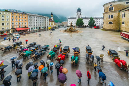 SALZBURG, AUSTRIA - JULY 31, 2014: Residenzbrunnen fountain on Residenzplatz located in Salzburg,...