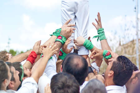 VILAFRANCA DEL PENEDES, SPAIN - AUG 29: Falcons casteller group on Cercavila performance within the Festa Major celebrations Aug 29, 2011 in Vilafranca del Penedes, Spain.のeditorial素材