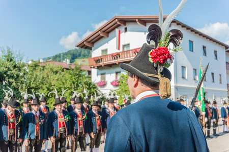 OBERPERFUSS, AUSTRIA - AUG 15: Villagers dressed in their finest traditional costumes during Maria Ascension procession along this village near Innsbruck on Aug 15, 2013 in Oberperfuss, Austria.のeditorial素材