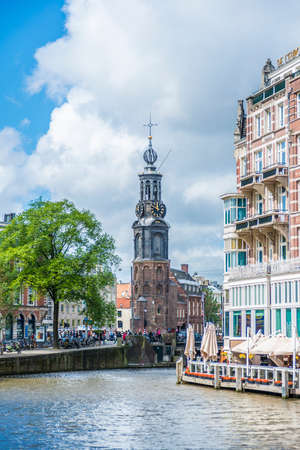 AMSTERDAM, NETHERLANDS â JUNE 15, 2013: The Munttoren (Mint Tower) Muntplein square, where the Amstel and the Singel canal meet, near the flower market and the end of Kalverstraat shopping street.のeditorial素材