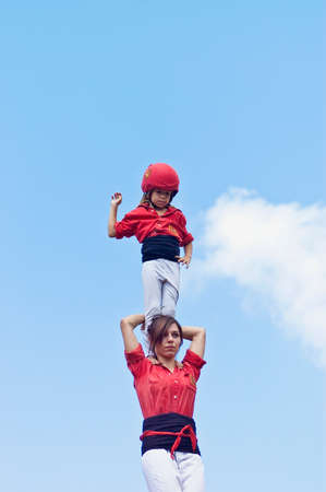 VILAFRANCA DEL PENEDES, SPAIN - AUG 29: Xicots casteller group on Cercavila performance within the Festa Major celebrations Aug 29, 2011 in Vilafranca del Penedes, Spain.のeditorial素材