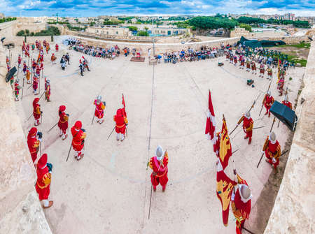 BIRGU - NOV 04: In Guardia re-enactment portraying the inspection of the fort and its garrison by the Grand Bailiff of the Order of the Knights of St. John on November 04, 2012 in Birgu, Malta.のeditorial素材