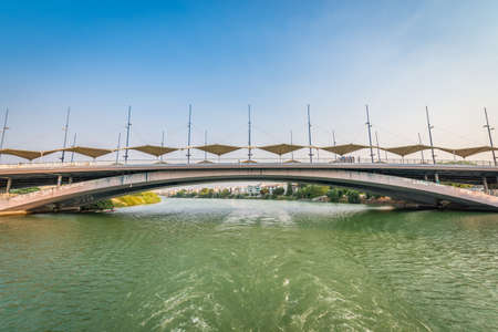 SEVILLE, ES - JULY 25, 2017: The bridge of the Santisimo Christ of the Expiration (Also known as Bridge of the Cachorro) is an urban bridge in the city of Seville that crosses the Guadalquivir river.のeditorial素材