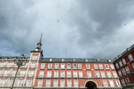 The Plaza Mayor was built during the Habsburg period and is the central plaza in the city, surrounded by three-story residential buildings having 237 balconies facing this square in Madrid, Spain.の写真素材