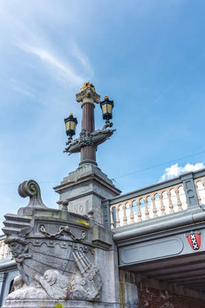 The Blauwbrug (Blue Bridge) connects the Rembrandtplein area with the Waterlooplein area in Amsterdam, Netherlands.の写真素材