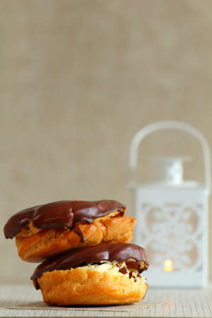 two buns chocolate and white lamp on wooden table