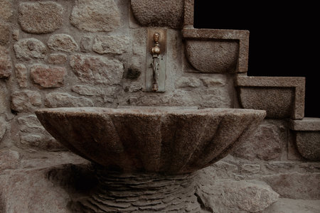 Historic sink in the castle with stairs in the backgroundの写真素材