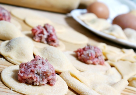 Preparing of pelmeni - meatballs in doughの写真素材