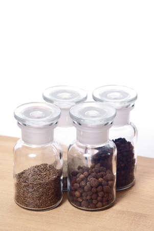 glass jar with spices - pepper, cumin, allspiceの写真素材