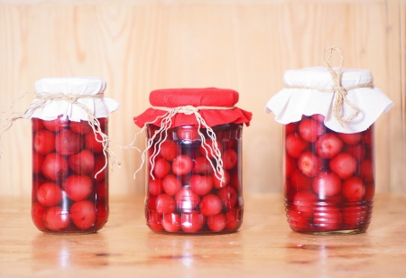 cherry compote in glass jar, studio shotの写真素材