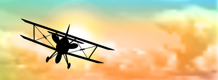 silhouette of biplane with colorful cloudscape in background, vector illustration, eps 10 with transparency and gradient meshのイラスト素材
