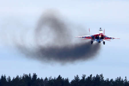 KUBINKA, MOSCOW REGION, RUSSIA - FEBRUARY 24, 2014: MiG-29UB jet fighter performing go around exercise at Kubinka air force base.のeditorial素材