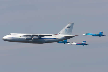 KHIMKI, MOSCOW REGION, RUSSIA - MAY 9, 2010: Antonov An-124 Ruslan and pair of Sukhoi Su-27 of...