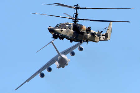 Zhukovsky, Moscow Region, Russia - August 18, 2013: Kamov Ka-52 062 YELLOW and Ilyushin IL-76MD-90A...