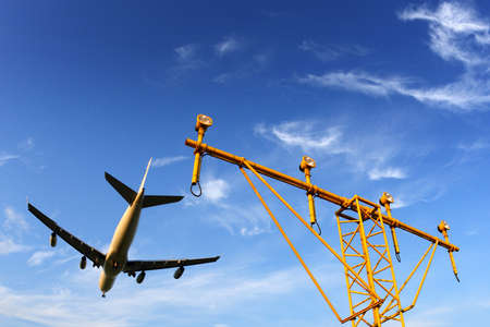 airplane in airport above landning lights.の写真素材
