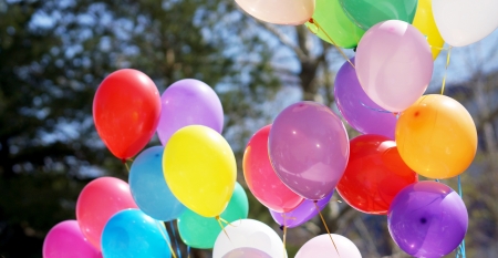 Many-colored balloons on the background of blue sky の写真素材