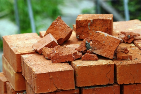 On the pallet with a red brick lies the wreckage.の写真素材