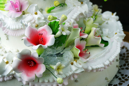 The cake is skillfully decorated with flowers made of cream.の写真素材