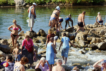 5 July 2013 ,the city Krasnousolsk , Bashkortostan,Russia . The feast of the Tabynsk icon of the Mother of God - the main Shrine of the believers of the southern Urals and Orenburg regions, Pilgrims collect water and medical dirt from a Holy source.のeditorial素材