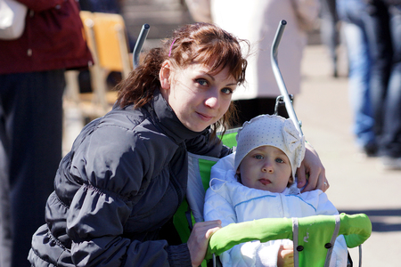 June 2013 , Beloretsk, Bashkortostan, Russia Happy young mother with a child for a walk.のeditorial素材