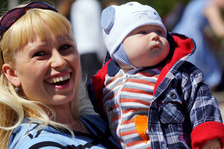 June 2013 , Beloretsk, Bashkortostan, Russia Happy young mother with a child for a walk.のeditorial素材