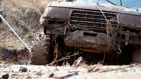 Extreme driving SUV to overcome the mud obstacles  の写真素材