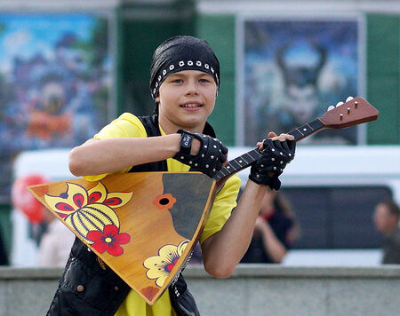 June 12, 2014, Beloretsk, Bashkortostan, Russia. Theatrical performance, dance, festivities in honor of celebration of day of Russia. Is children's dancing ensemble "Inspiration", a dance with balalaika rock music.のeditorial素材
