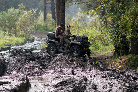 13.09.2014, Beloretsk, Bashkortostan, Russia, the second stage of the seventh championship of the Republic of Bashkortostan trophy-RAID "Sargassi 2014" Quadrocycle is in the process of overcoming terrain.のeditorial素材