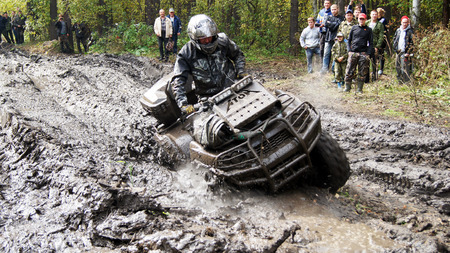 13.09.2014, Beloretsk, Bashkortostan, Russia, the second stage of the seventh championship of the Republic of Bashkortostan trophy-RAID "Sargassi 2014" Quadrocycle is in the process of overcoming terrain.のeditorial素材