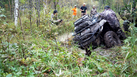 13.09.2014, Beloretsk, Bashkortostan, Russia, the second stage of the seventh championship of the Republic of Bashkortostan trophy-RAID "Sargassi 2014" Quadrocycle is in the process of overcoming terrain.のeditorial素材
