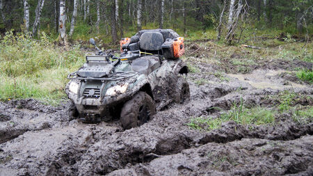 ATV stuck in the mud at overcoming mud obstacles.の写真素材