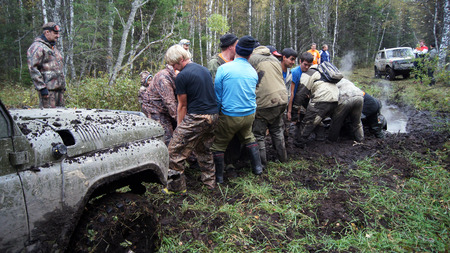 13.09.2014, Beloretsk, Bashkortostan, Russia, the second stage of the seventh championship of the Republic of Bashkortostan trophy-RAID "Sargassi 2014". ATV stuck in the mud at overcoming mud obstacles.のeditorial素材