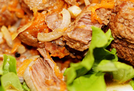 Fried meat,seasoned with spices, onions and carrots.の写真素材