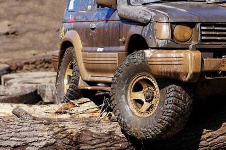 Extreme driving on overcoming mud obstacles.のeditorial素材