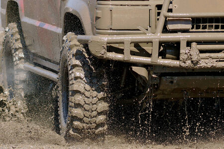Extreme driving on overcoming mud obstacles.のeditorial素材