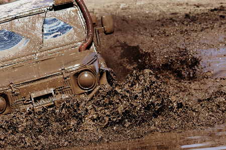 Extreme driving on overcoming mud obstacles.のeditorial素材