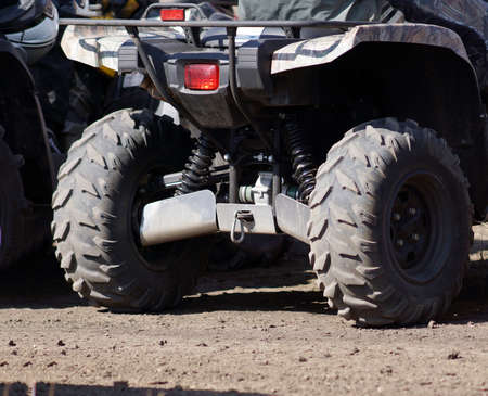 Extreme driving ATV on overcoming mud obstacles.の写真素材