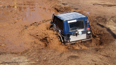 SUV overcomes obstacles dirt.