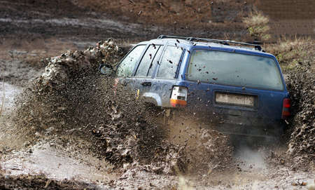 Extreme driving on overcoming mud obstacles.の写真素材