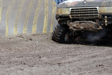 Extreme driving on overcoming mud obstacles.