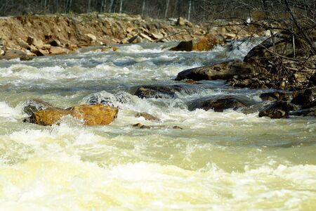 The rapid flow of water during floods in the mountains.の写真素材
