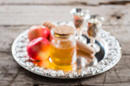 Defocused bokeh background of Honey Jar and Apples. Jewish Holiday Rosh Hashanah Conceptの写真素材
